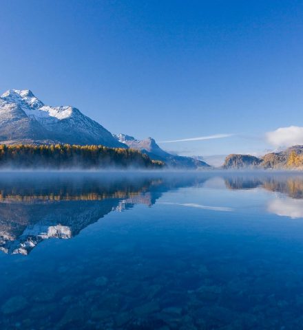 ENGADIN St. Moritz - Golden larch trees by Lake Sils, in the background Piz la Margna (3159 m), Piz Salacina (2'599 m) and Piz Lunghin (2'780 m).ENGADIN St. Moritz - Golden larch trees by Lake Sils, with Piz la Margna (3,159m), Piz Salacina (2,599m) and Piz Lunghin (2,780m) in the background.ENGADIN St. Moritz - larici dorati al lago di Sils, sullo sfondo il Piz la Margna (3`159 m) , Piz Salacina (2,599 m) and Piz Lunghin (2,780 m).Copyright by ENGADIN St. Moritz By-line:swiss-image.ch/Christof Sonderegger